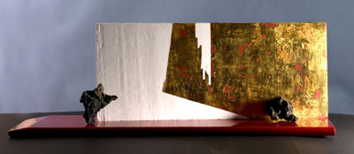 Christine Aveil's Mendiants, 2009, lava stones, gold leaf and lacquer on wood, 41 inches x 14 inches x 10 inches