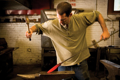 Paul Cooper hammering, MCC Folk Arts Apprenticeship - Bladesmithing, 2007, photography by Billy Howard