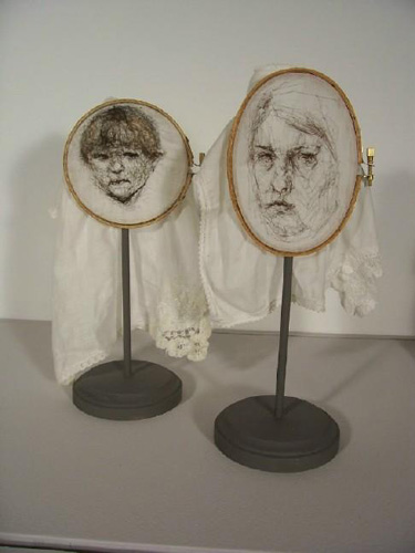Leslie Schomp, SELF PORTRAIT WITH SON (2007), hair and nylon thread on found handkerchiefs, embroidery hoops
