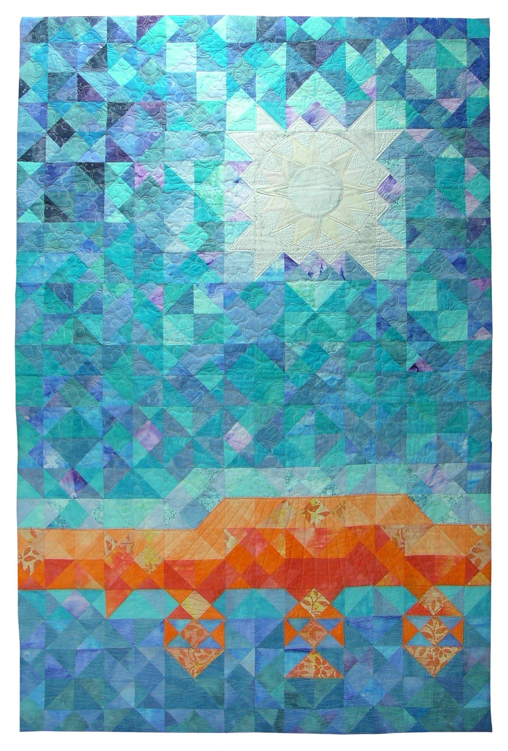 Fabric assemblage resembling a blue sky and sun over an orange coastline.