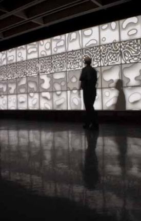 Still of Brian Kneps Drift Wall, interactive video installation, 20x8 (2007)