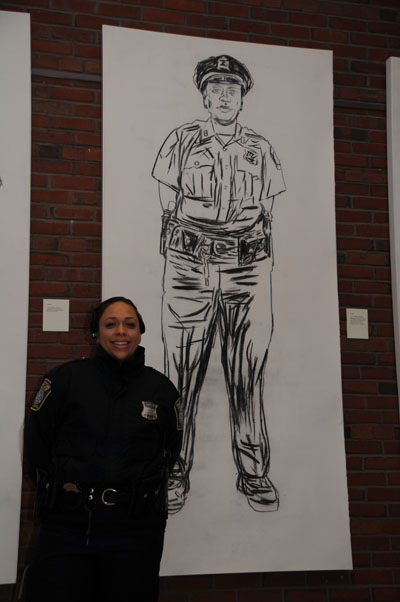 Antionette Rafeal in front of her portrait.