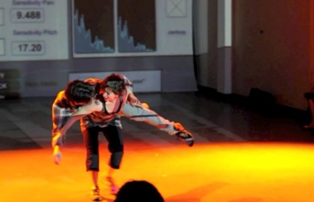 Still from RE, choreography by Jennifer Polins (pictured, with Saliq Savage)