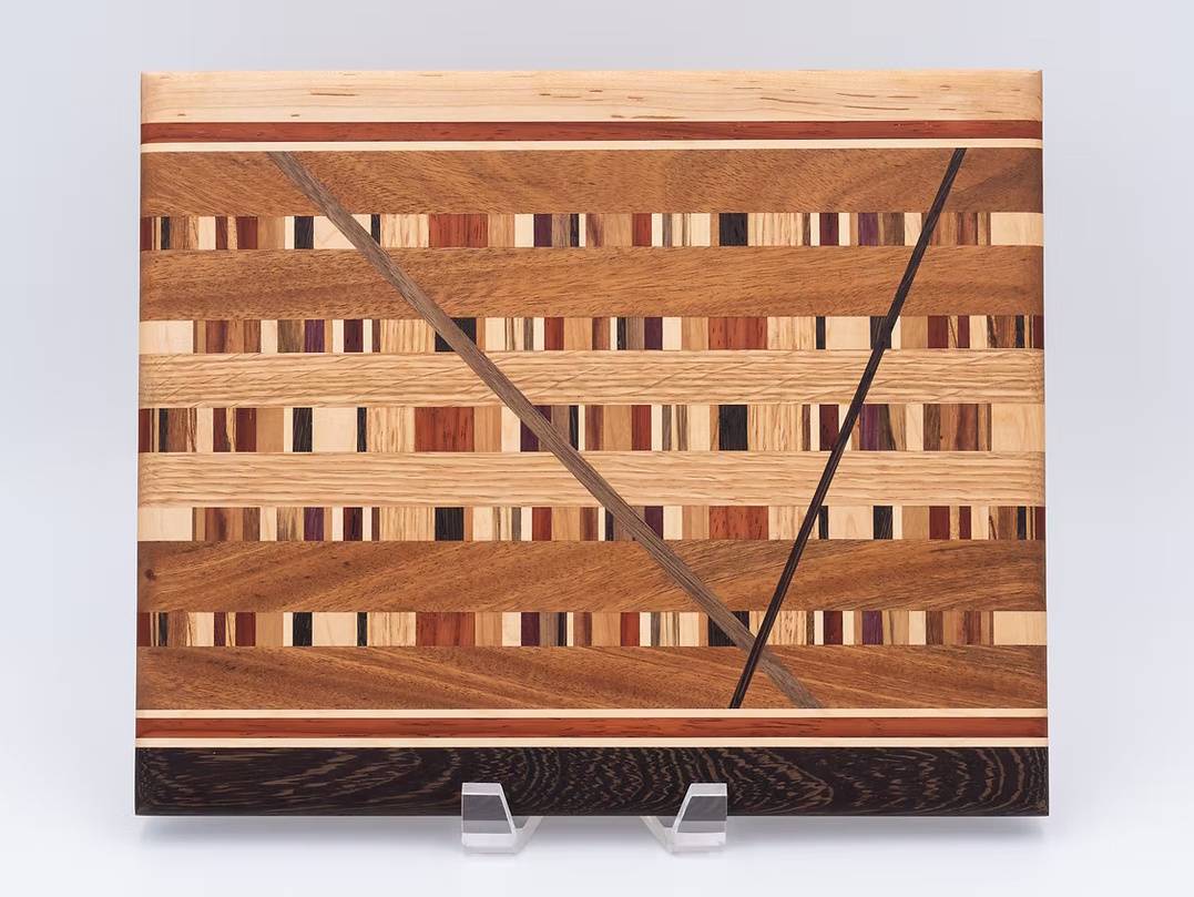 Photograph of a hand-crafted wooden cutting board.